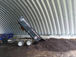 dump trailer on the compost processing pad